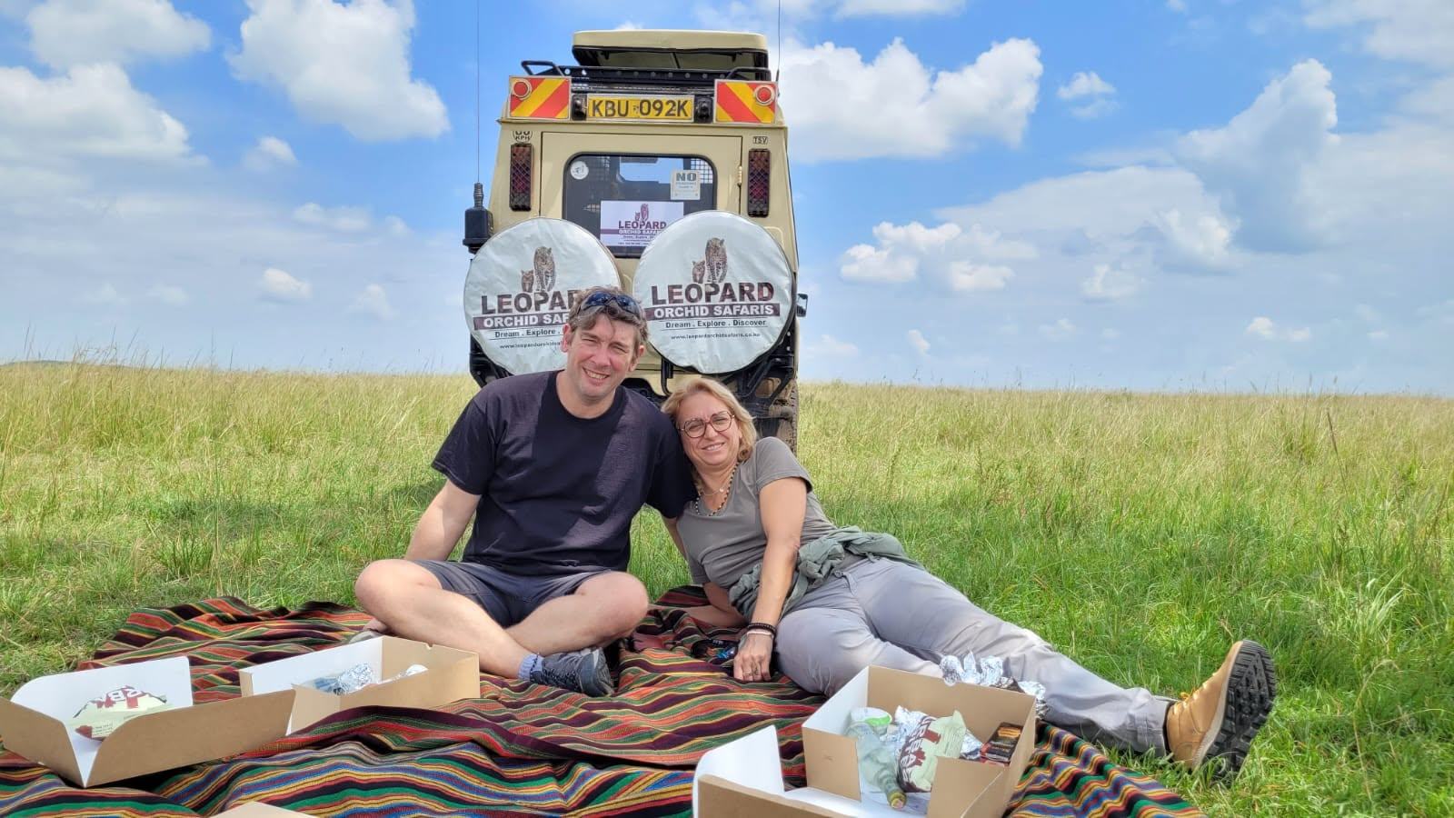 Guests laughing during a game drive sighting