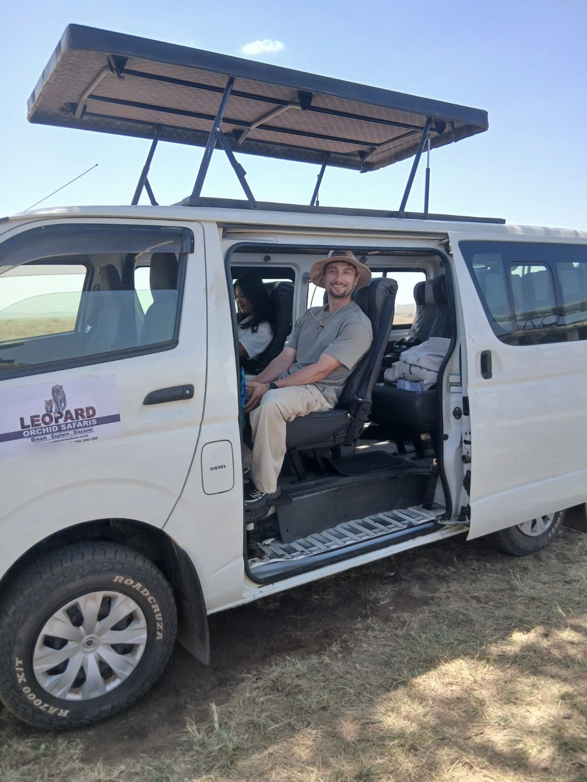 Guest seated in our pop-top safari van before a game drive