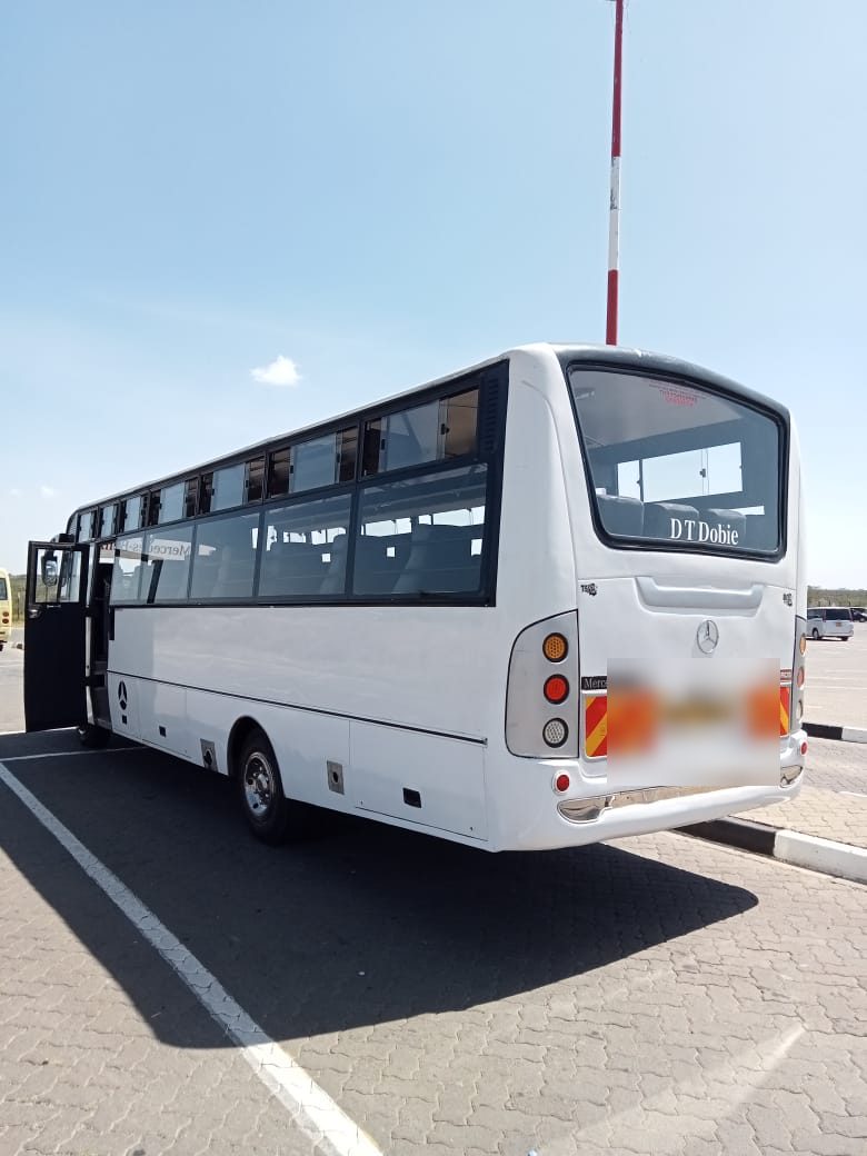 Rear view of the Mercedes Benz coach with full luggage bays